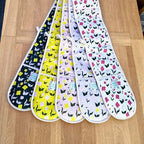 Double oven gloves with First Flowers pattern in Forest Green, Sunshine Yellow, Ballet Pink, Lilac Dusk and Tea Green