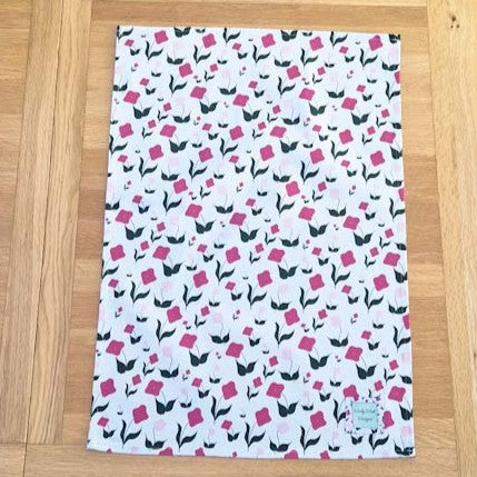 Organic cotton tea towel with First Flowers pattern in Tea Green