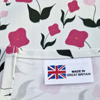 Organic cotton tea towel with First Flowers pattern in Tea Green