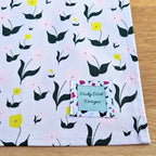 Organic cotton tea towel with First Flowers pattern in Lilac Dusk