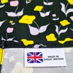 Organic cotton tea towel with First Flowers pattern in Forest Green